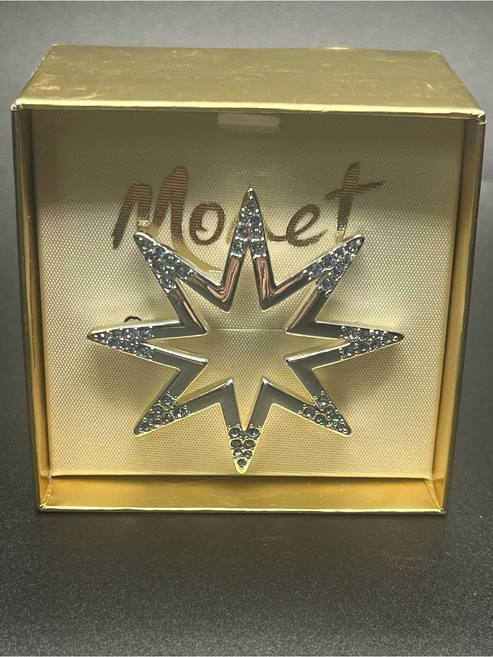 Monet blue rhinestone starburst brooch pin